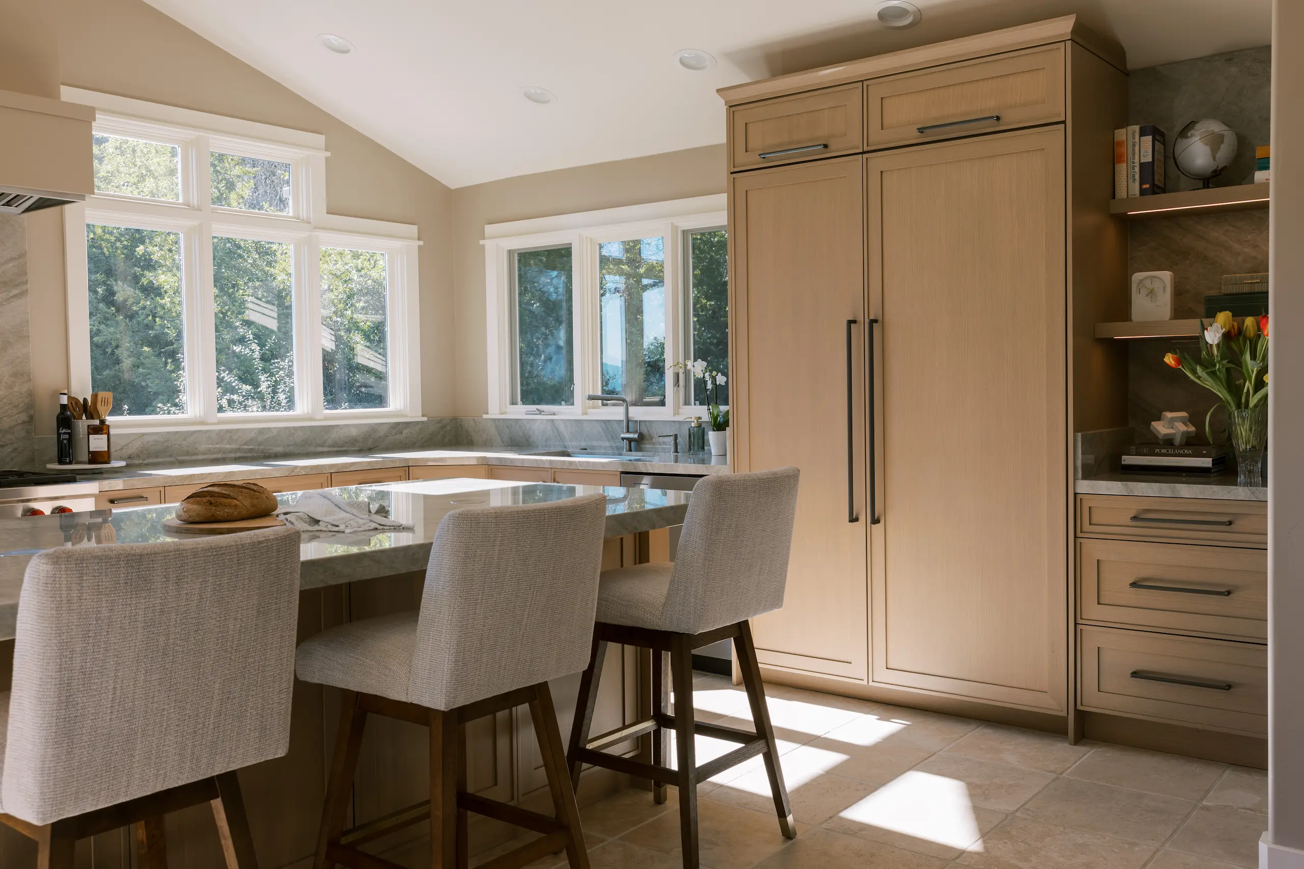 Light-filled contemporary kitchen with custom Wood-Mode cabinetry